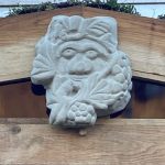 Green man with bees and grapes